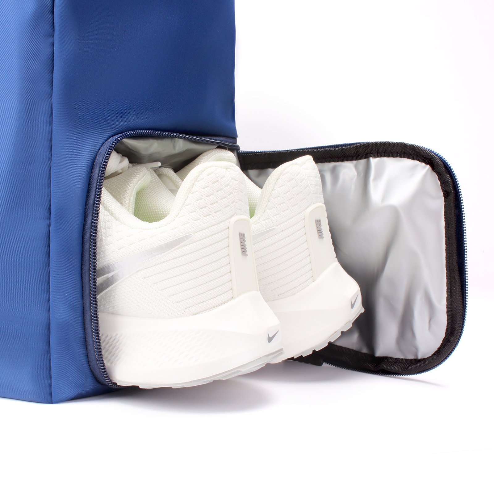 Separate shoe compartment inside the blue tennis tote