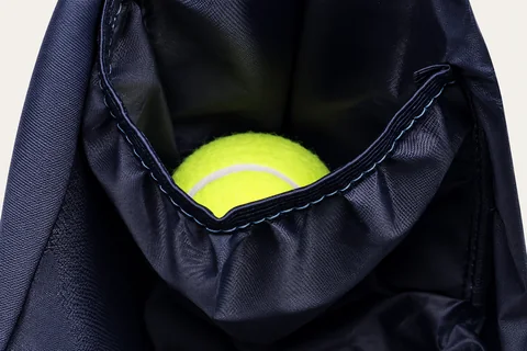 Left interior pocket holding a tennis ball.